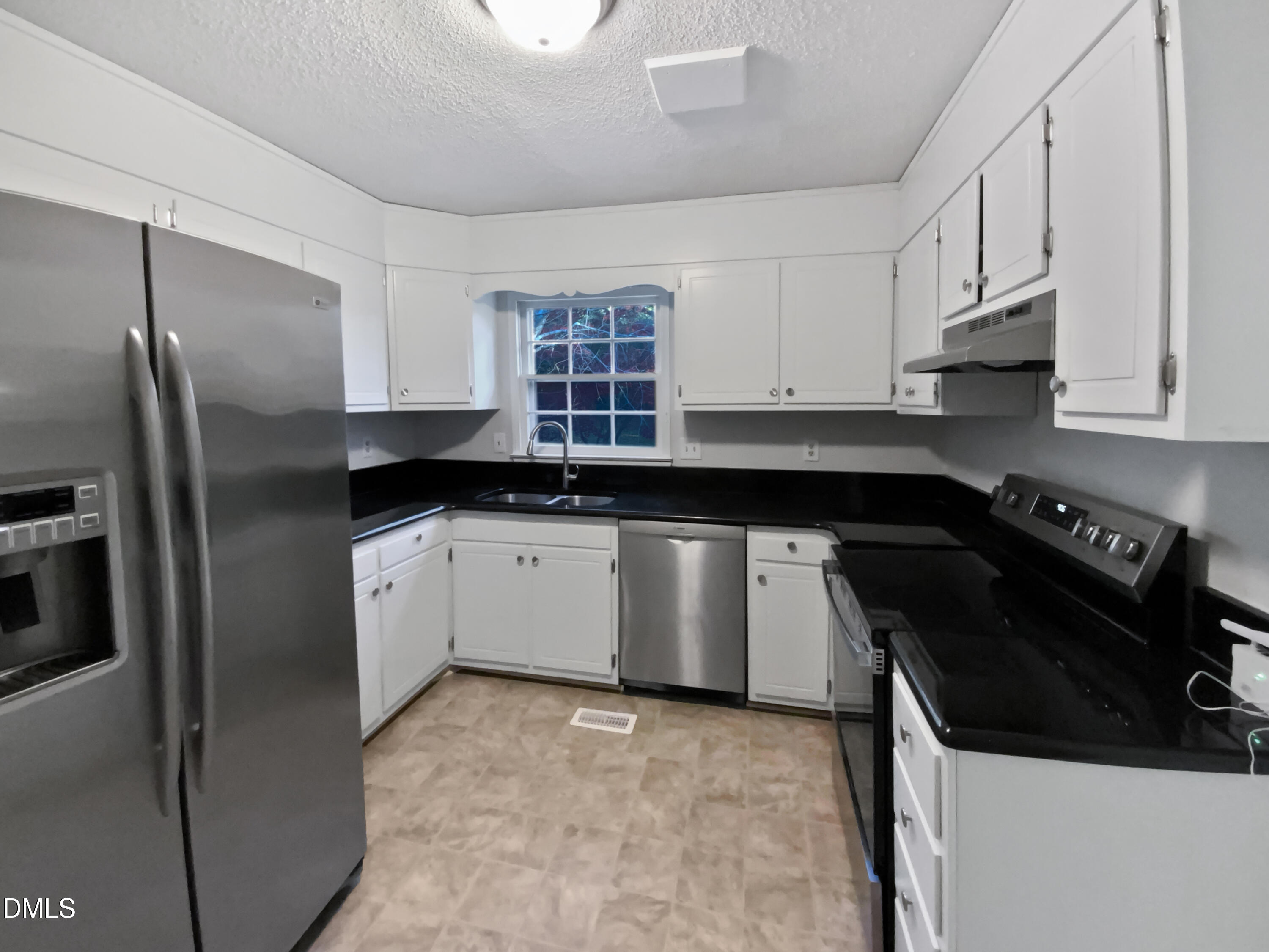 3136 Merrianne Drive Raleigh, NC 27607 - Photo 2 of 20 a kitchen with a sink stove and refrigerator