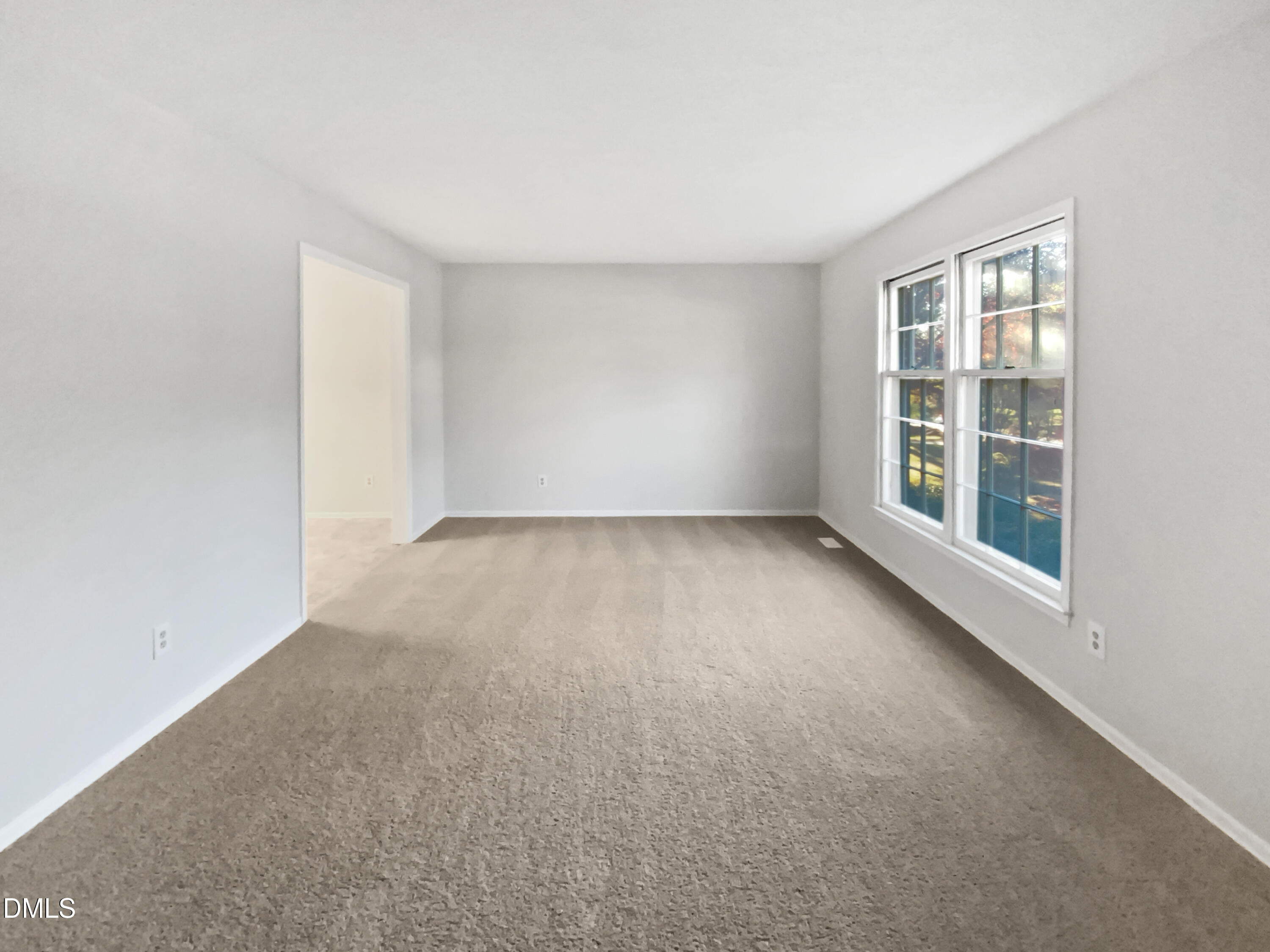 3136 Merrianne Drive Raleigh, NC 27607 - Photo 3 of 20 an empty room with windows
