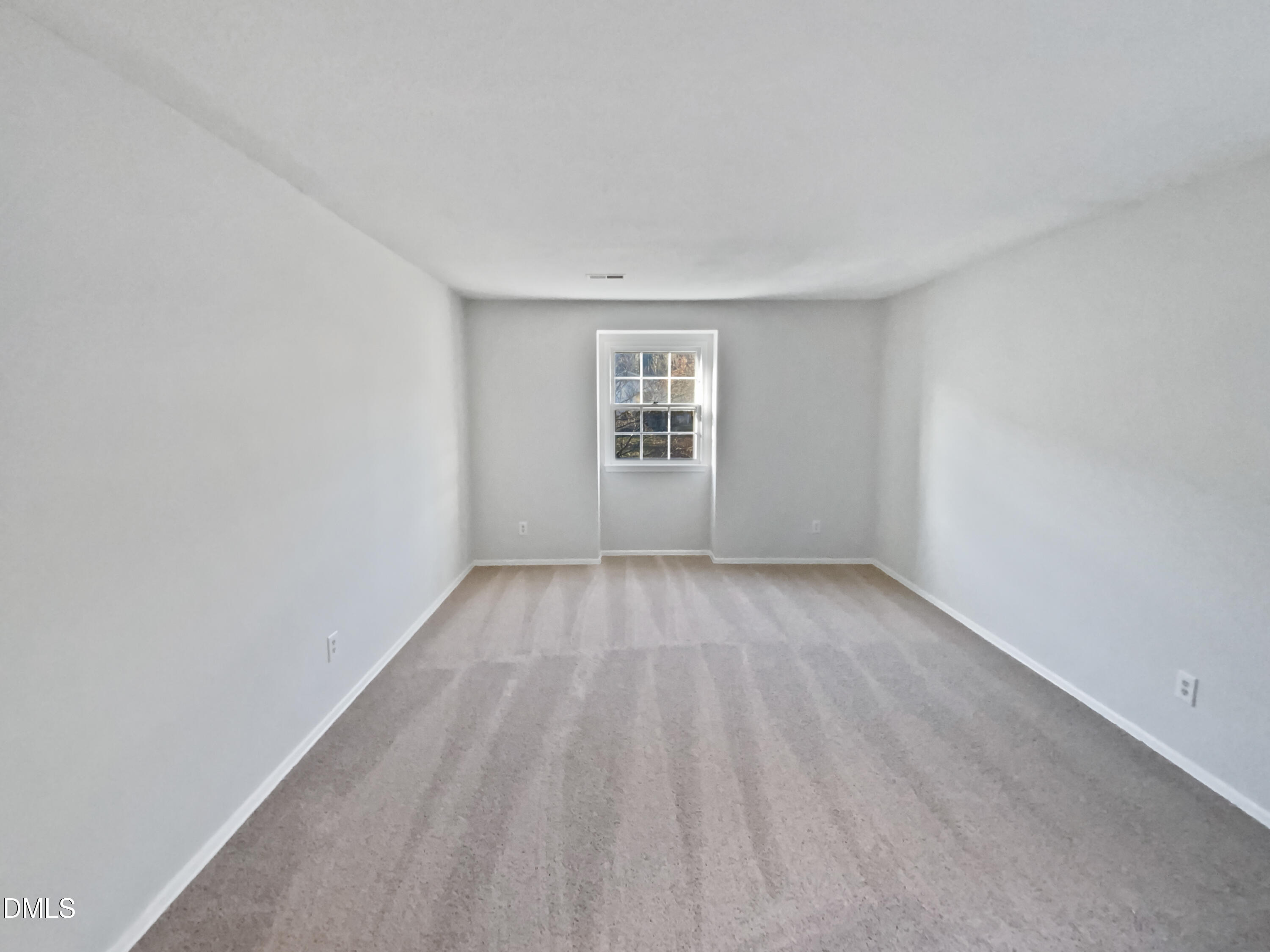 3136 Merrianne Drive Raleigh, NC 27607 - Photo 9 of 20 a view of a big room with wooden floor and windows in a room