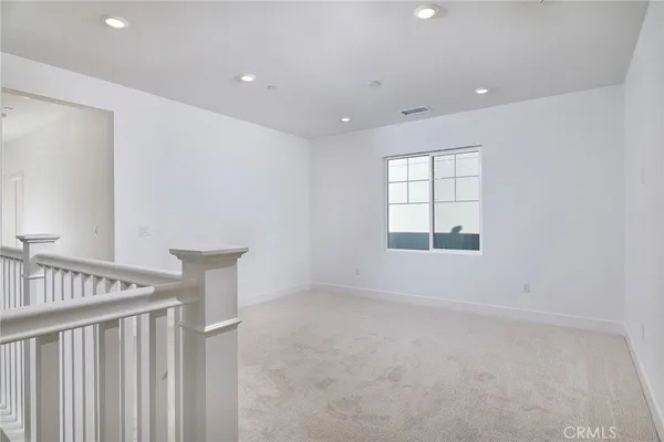 a spacious bathroom with a granite countertop sink mirror and shower