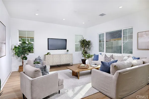 a living room with furniture and a large window