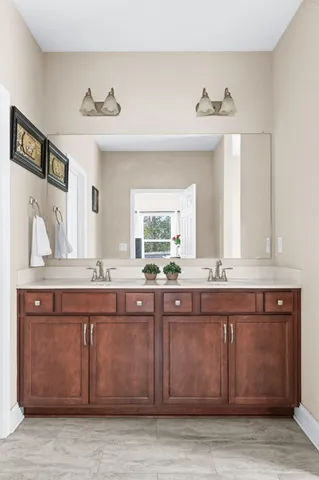 a bathroom with a sink and a mirror