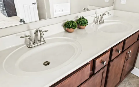 a bathroom with a sink and a mirror
