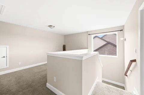 a view of hallway with stairs