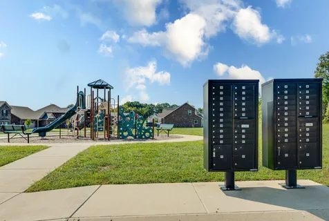 a view of a park with swings and slides