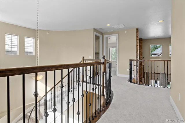a view of staircase with rug floor