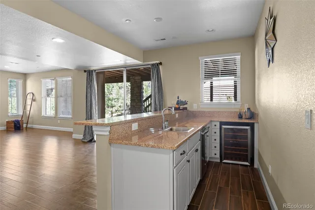 a kitchen with sink and window
