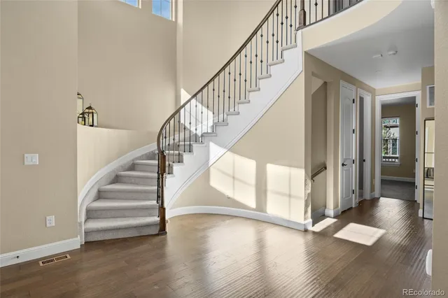 a view of staircase with wooden floor and stairs