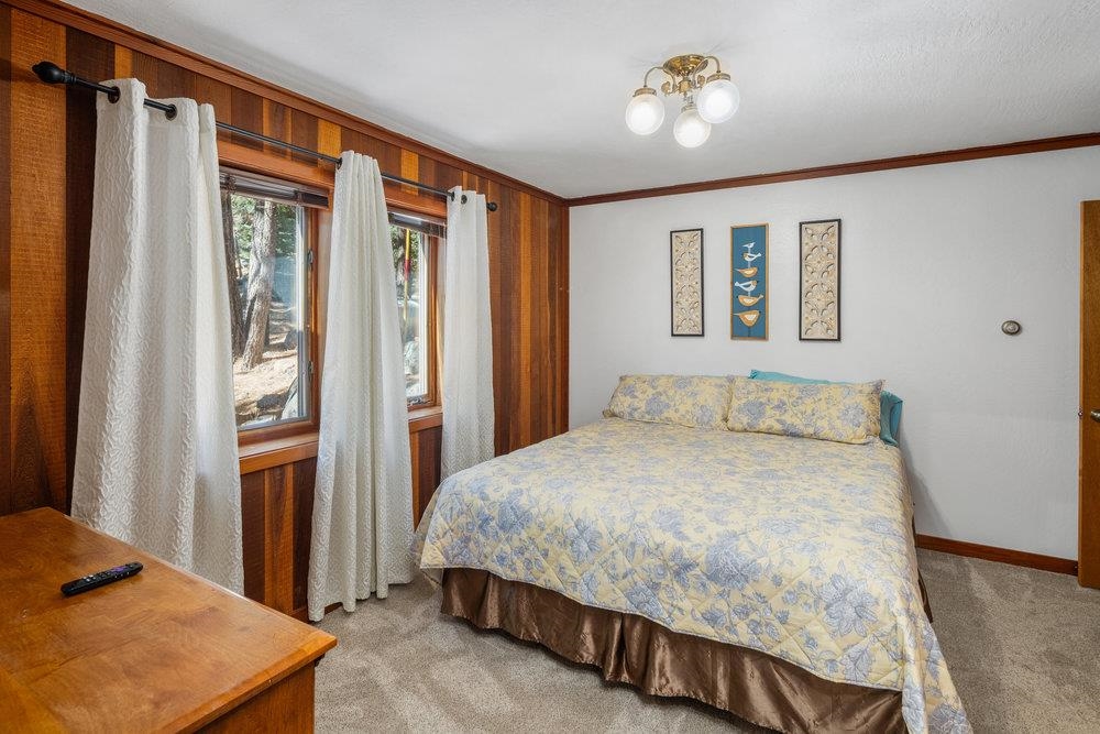 138 Tiger Tail Road Olympic Valley, CA 96146 - Photo 17 of 28 a bedroom with a bed dresser and a window