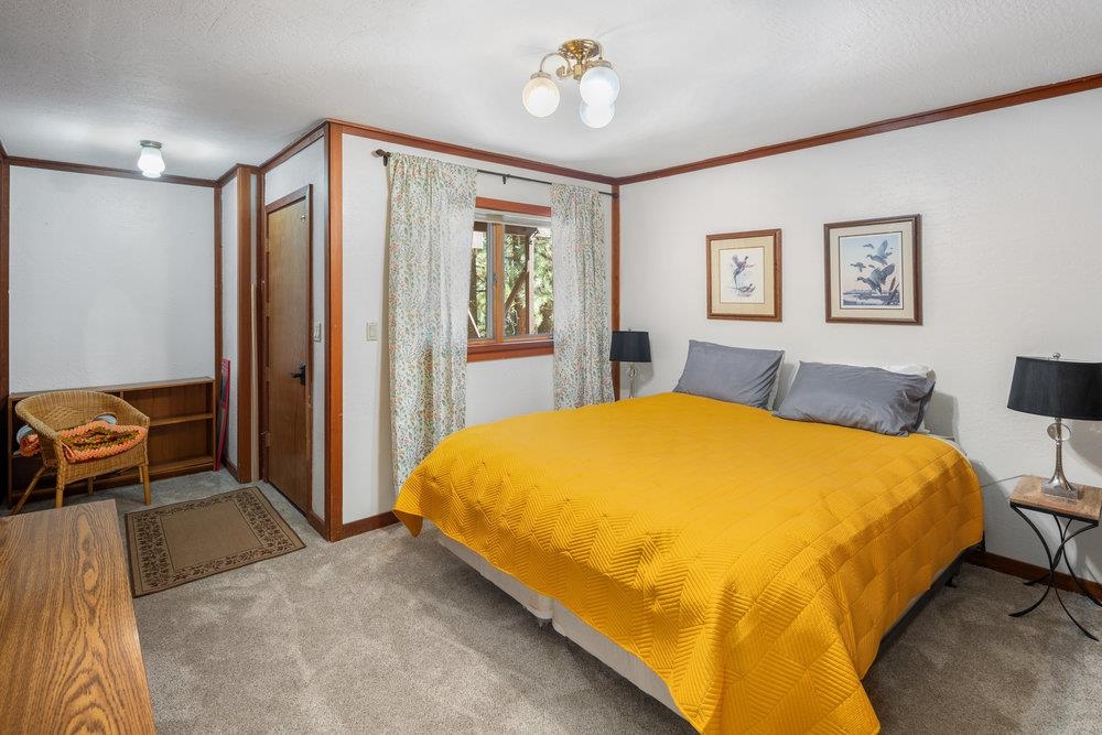 138 Tiger Tail Road Olympic Valley, CA 96146 - Photo 18 of 28 a spacious bedroom with a bed and a dresser