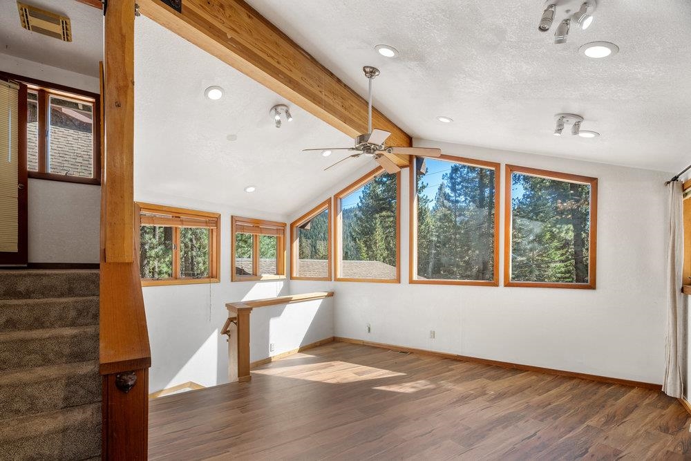 138 Tiger Tail Road Olympic Valley, CA 96146 - Photo 21 of 28 a view of an empty room with wooden floor and a window