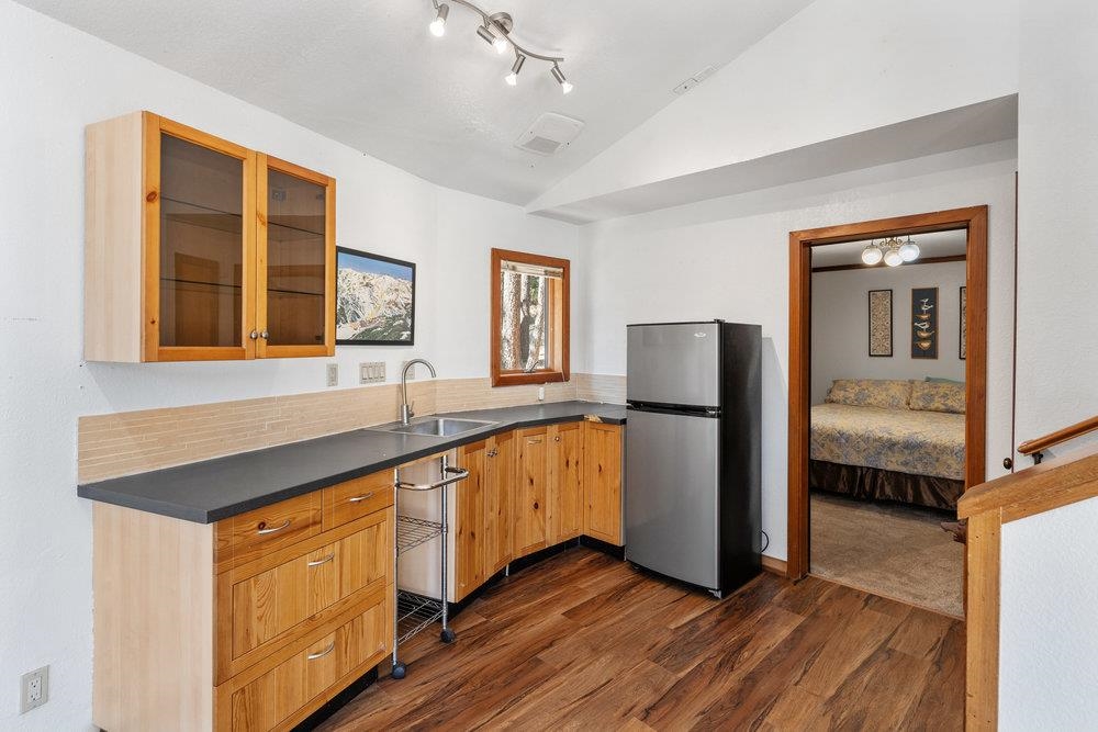138 Tiger Tail Road Olympic Valley, CA 96146 - Photo 22 of 28 a view of a kitchen cabinets and wooden floor