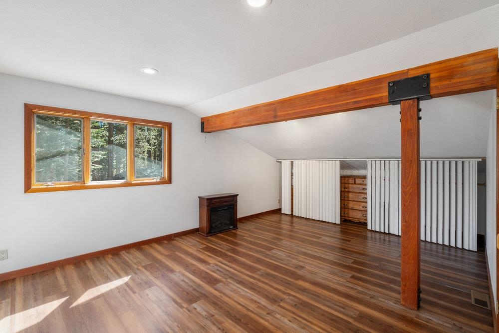 138 Tiger Tail Road Olympic Valley, CA 96146 - Photo 26 of 28 a view of an empty room with wooden floor and a window