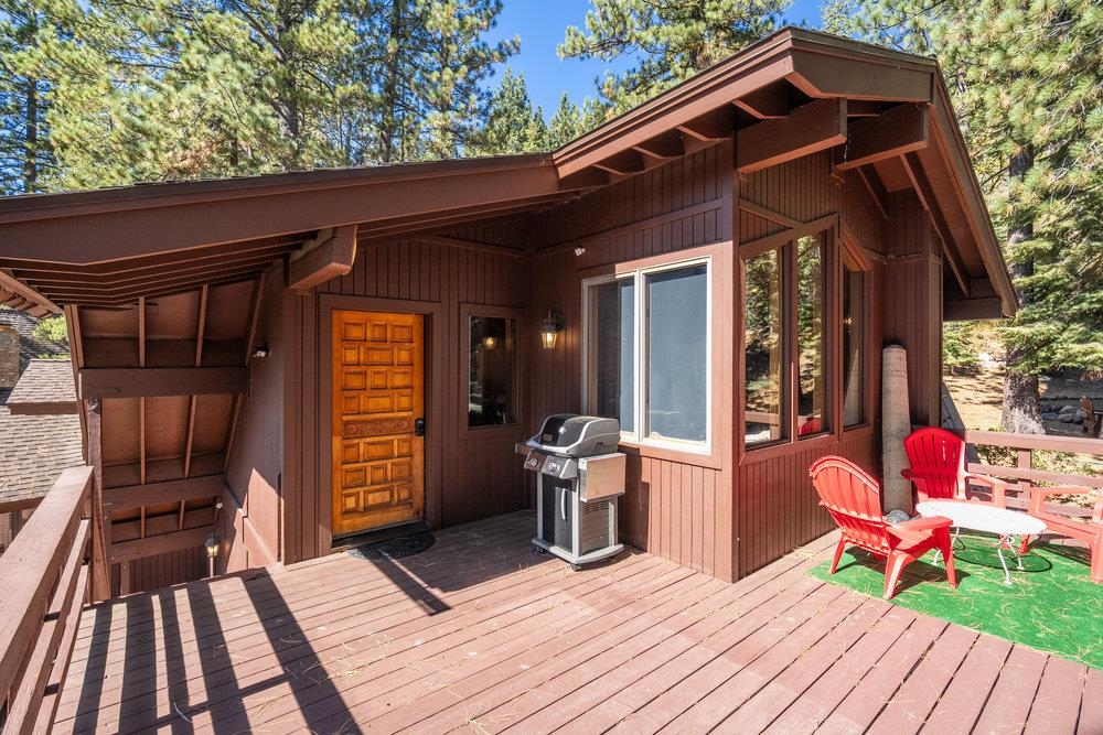 138 Tiger Tail Road Olympic Valley, CA 96146 - Photo 3 of 28 a front view of a house with barbeque oven and seating space