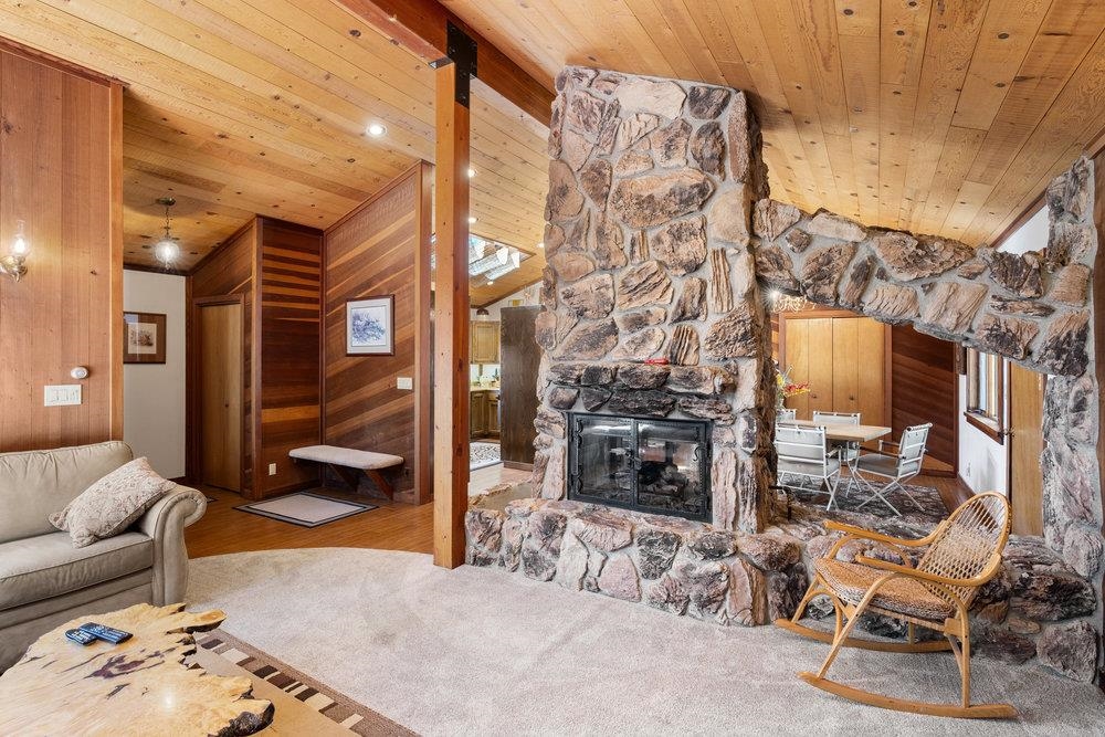 138 Tiger Tail Road Olympic Valley, CA 96146 - Photo 8 of 28 a living room with furniture and a fireplace