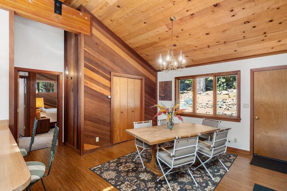 138 Tiger Tail Road Olympic Valley, CA 96146 - Photo 9 of 28 a dining room with furniture window and wooden floor