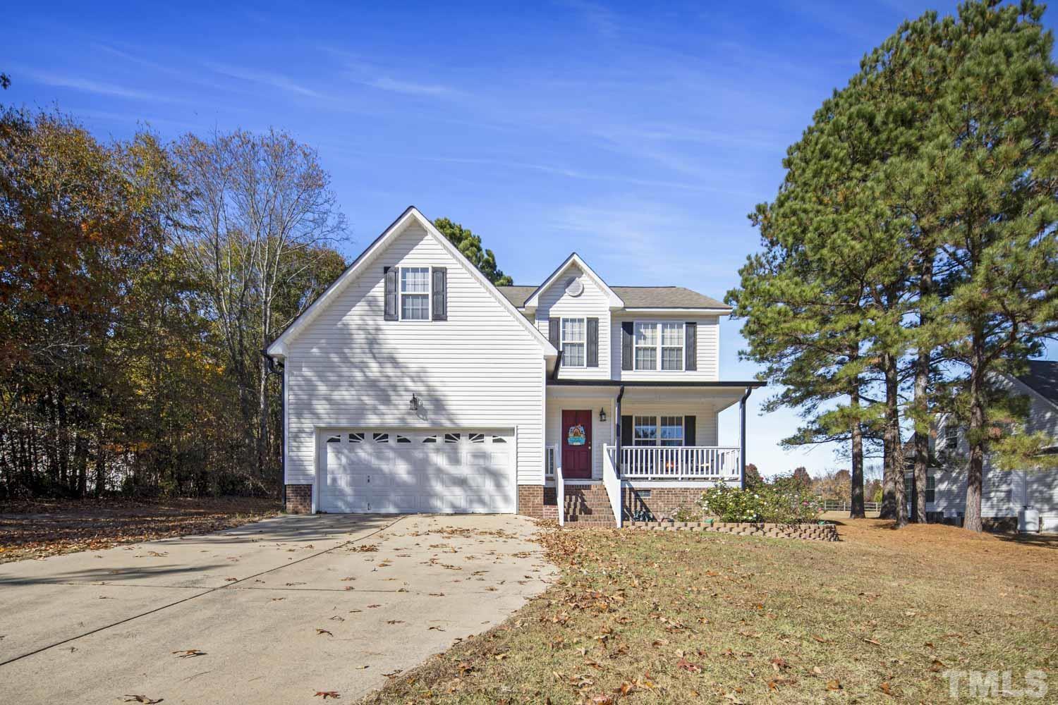 476 Saddle Ridge Drive Willow Spring, NC 27592 - Photo 1 of 30 front view of a house with a yard