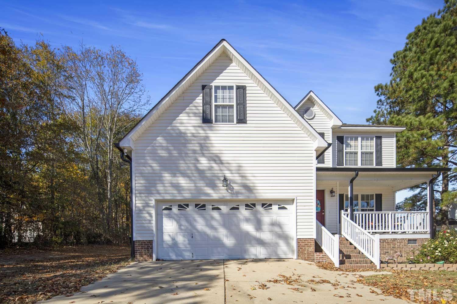 476 Saddle Ridge Drive Willow Spring, NC 27592 - Photo 2 of 30 a view of a house with a yard