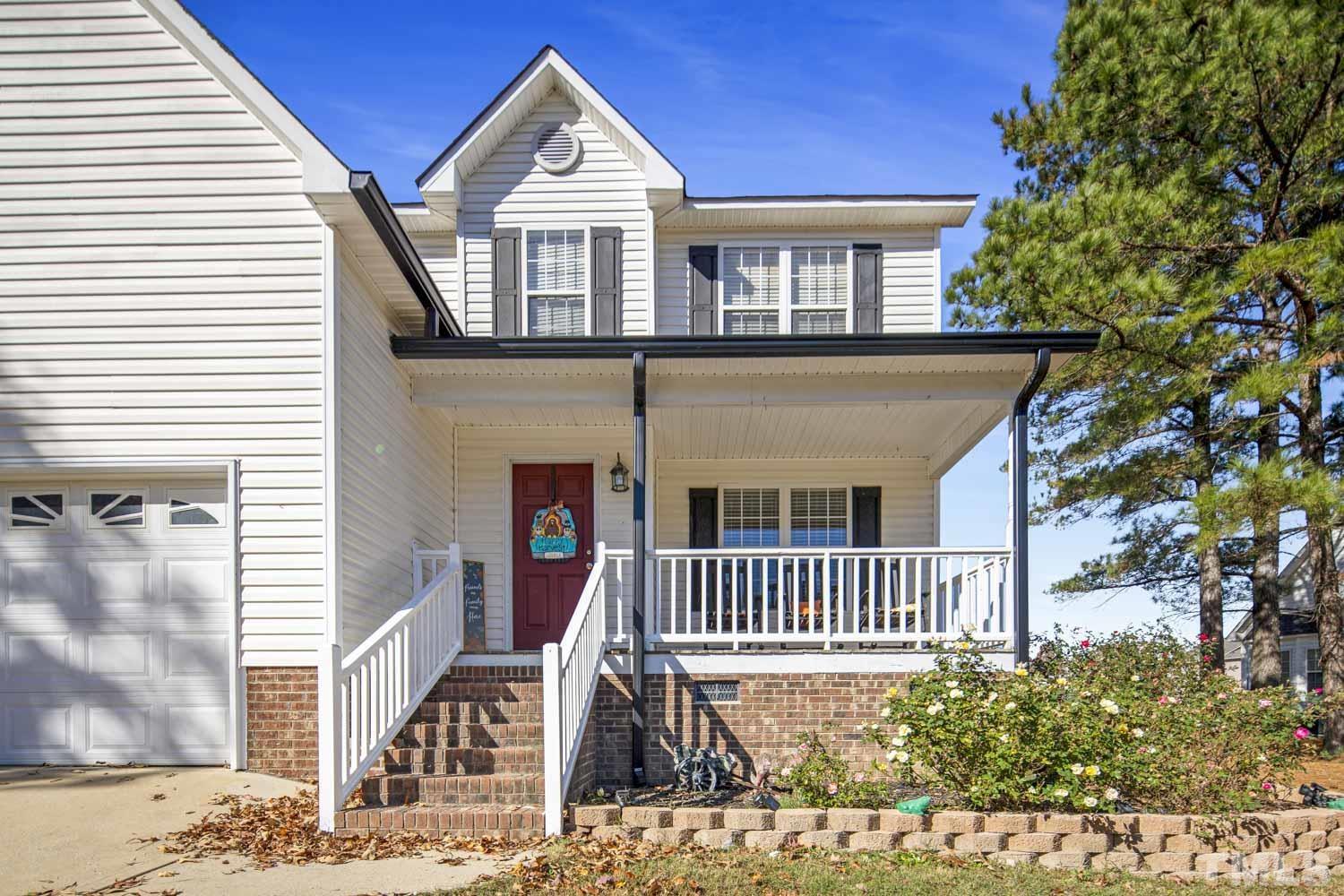 476 Saddle Ridge Drive Willow Spring, NC 27592 - Photo 3 of 30 a front view of a house with a yard