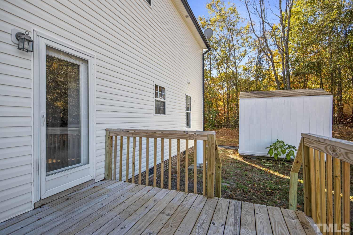 476 Saddle Ridge Drive Willow Spring, NC 27592 - Photo 28 of 30 a view of backyard with deck and wooden floor