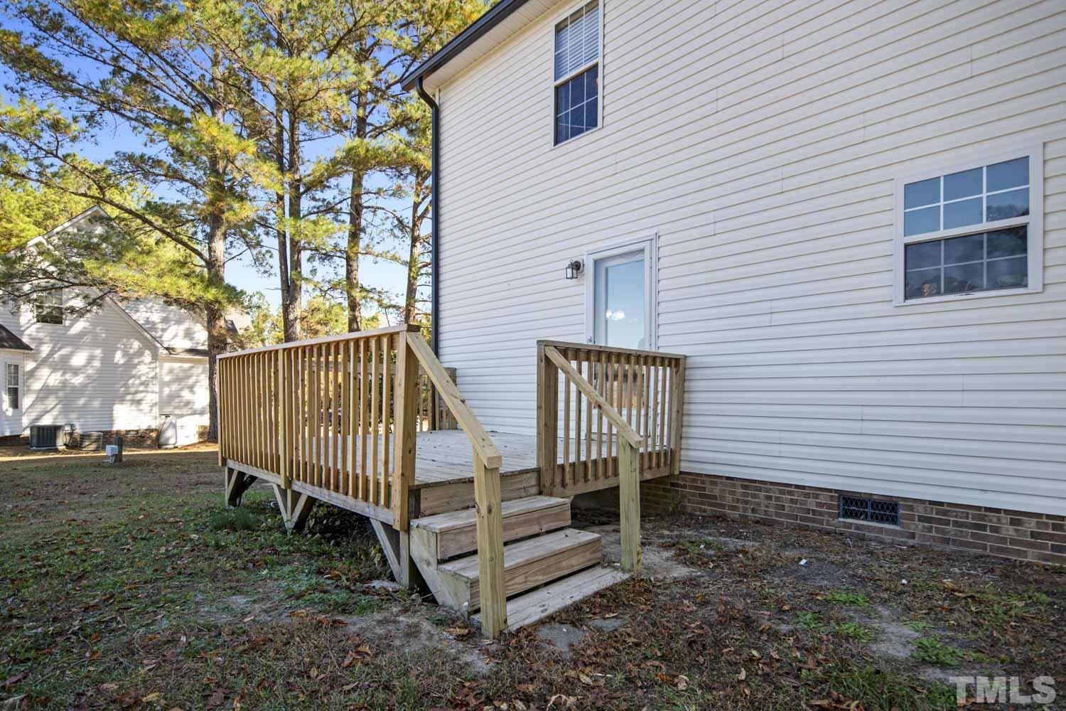 476 Saddle Ridge Drive Willow Spring, NC 27592 - Photo 30 of 30 a view of backyard with deck and deck
