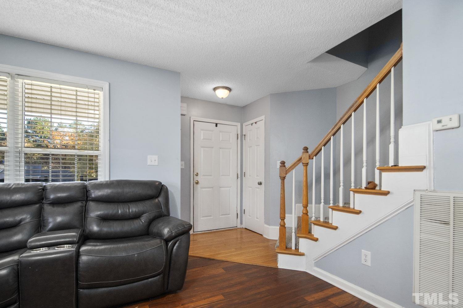 476 Saddle Ridge Drive Willow Spring, NC 27592 - Photo 5 of 30 a living room with furniture or stairs and a window