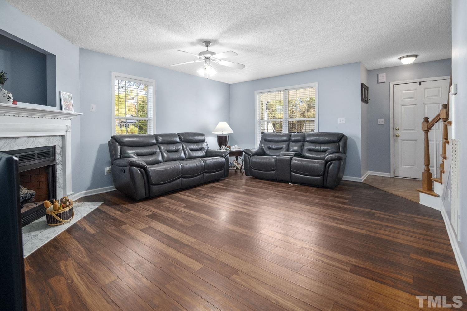 476 Saddle Ridge Drive Willow Spring, NC 27592 - Photo 8 of 30 a living room with furniture and a fireplace