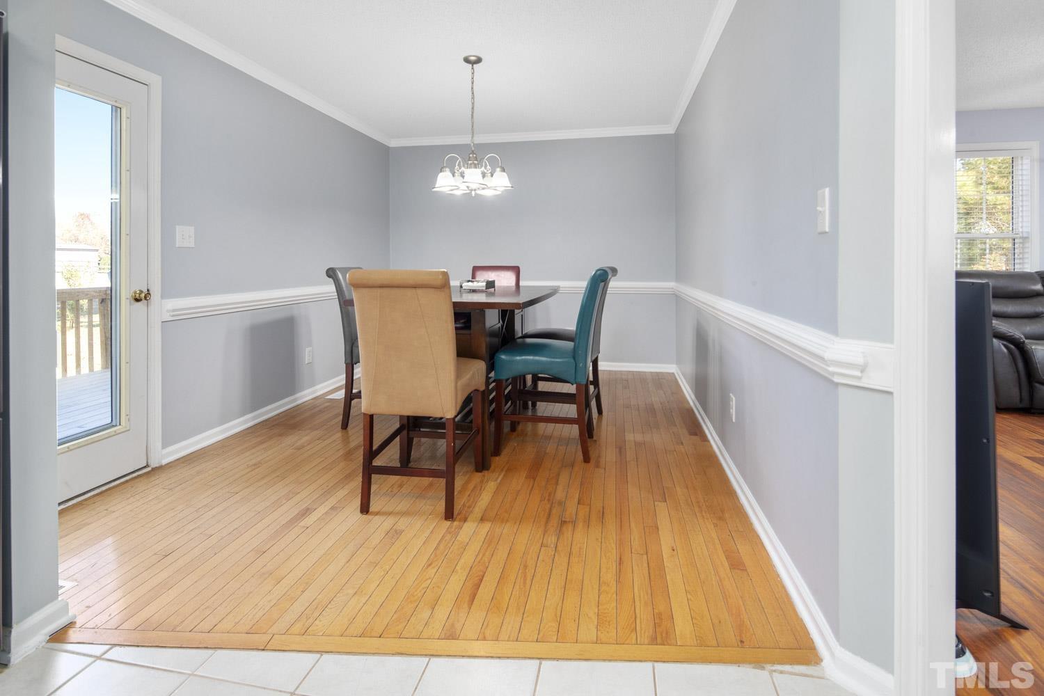 476 Saddle Ridge Drive Willow Spring, NC 27592 - Photo 9 of 30 a view of a dining room with furniture and wooden floor