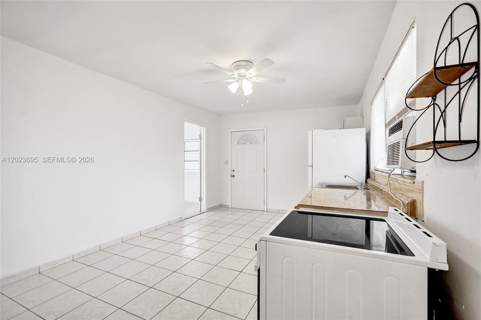 877 West 33rd Street, Unit A Hialeah, FL 33012 - Photo 16 of 36 Kitchen/Family/Dining Area
