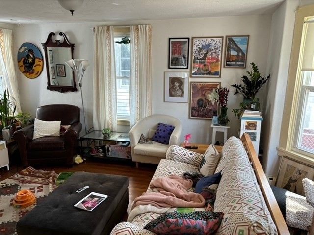 a living room with furniture and a window