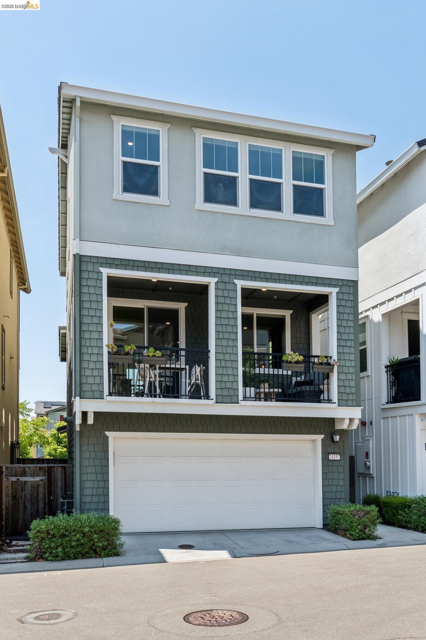 24157 Amaranth Loop Hayward, CA 94541 - Photo 56 of 63 Contemporary multi-story residence featuring a two-tone facade with a stucco upper level and shingle siding on the mid-level