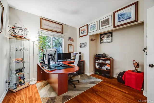 a living room with furniture a rug and a window