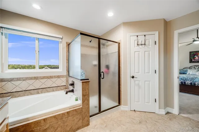 a bathroom with a bathtub and a shower