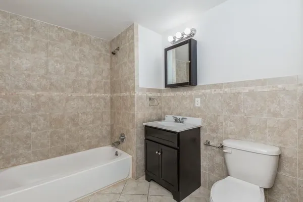 a bathroom with a toilet sink and bathtub