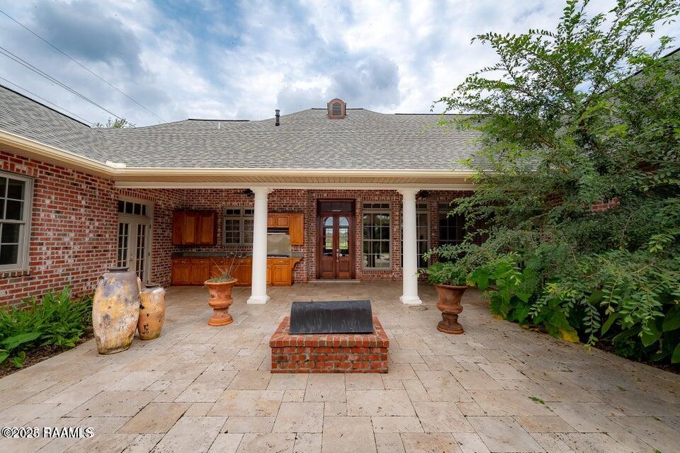 99 University Place Eunice, LA 70535 - Photo 31 of 34 patio firepit