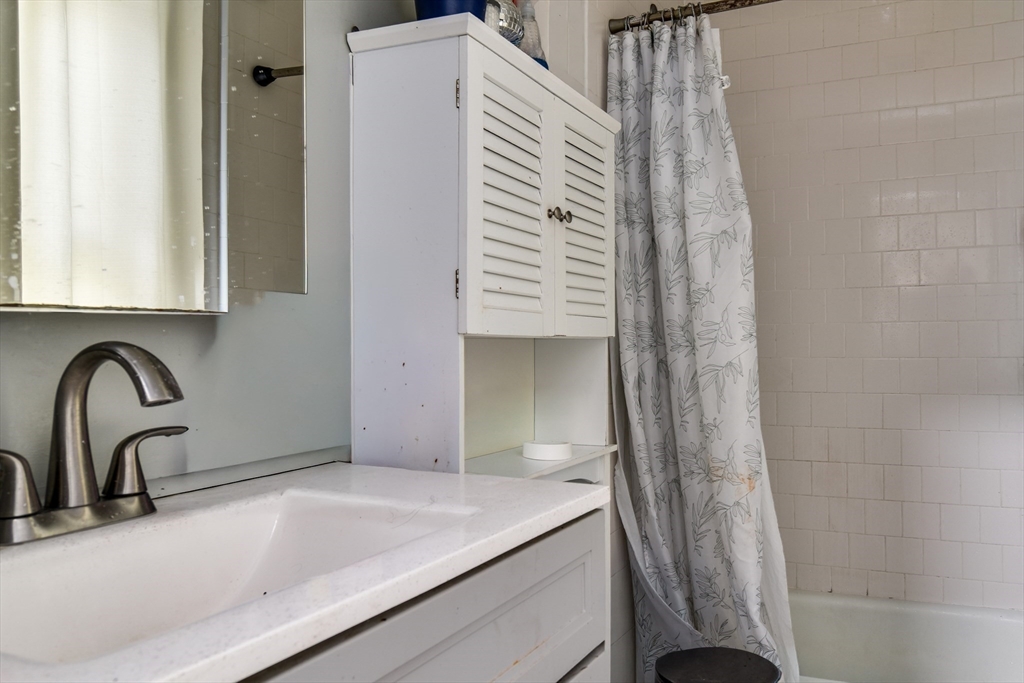 136 Commonwealth Road Wayland, MA 01778 - Photo 6 of 27 a bathroom with a sink and a bathtub