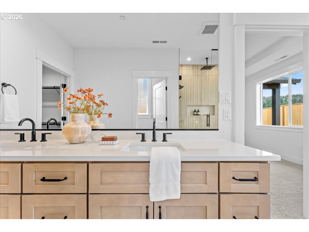 789 Riley Drive Northeast Silverton, OR 97381 - Photo 19 of 24 a bathroom with a sink vanity granite and a mirror