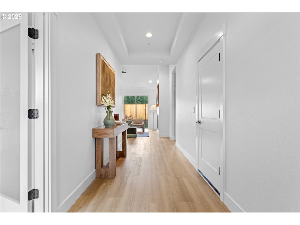 789 Riley Drive Northeast Silverton, OR 97381 - Photo 2 of 24 a open kitchen with white cabinets and wooden floor