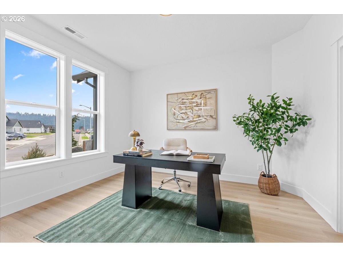 789 Riley Drive Northeast Silverton, OR 97381 - Photo 21 of 24 a living room with furniture a potted plant and a large window