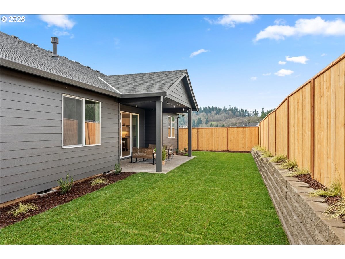 789 Riley Drive Northeast Silverton, OR 97381 - Photo 24 of 24 a view of a backyard with plants and a patio