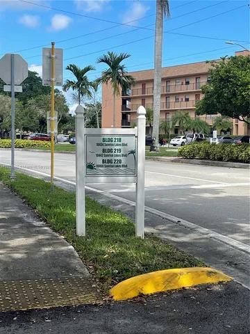 a view of a swimming pool with a yard