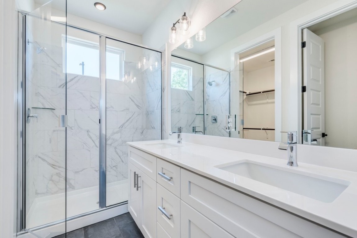 2600 Gattis School Road, Unit 101 Round Rock, TX 78664 - Photo 10 of 23 a bathroom with a shower sink and mirror