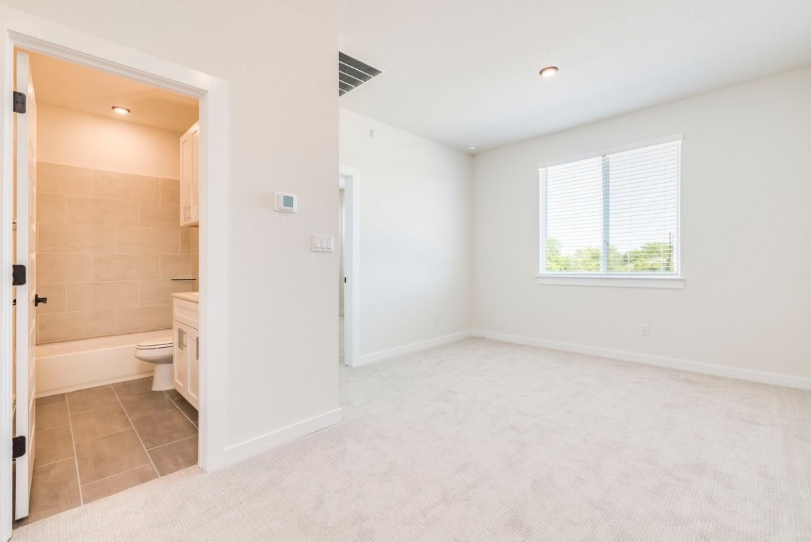 2600 Gattis School Road, Unit 101 Round Rock, TX 78664 - Photo 14 of 23 an empty room with a bathroom and a toilet