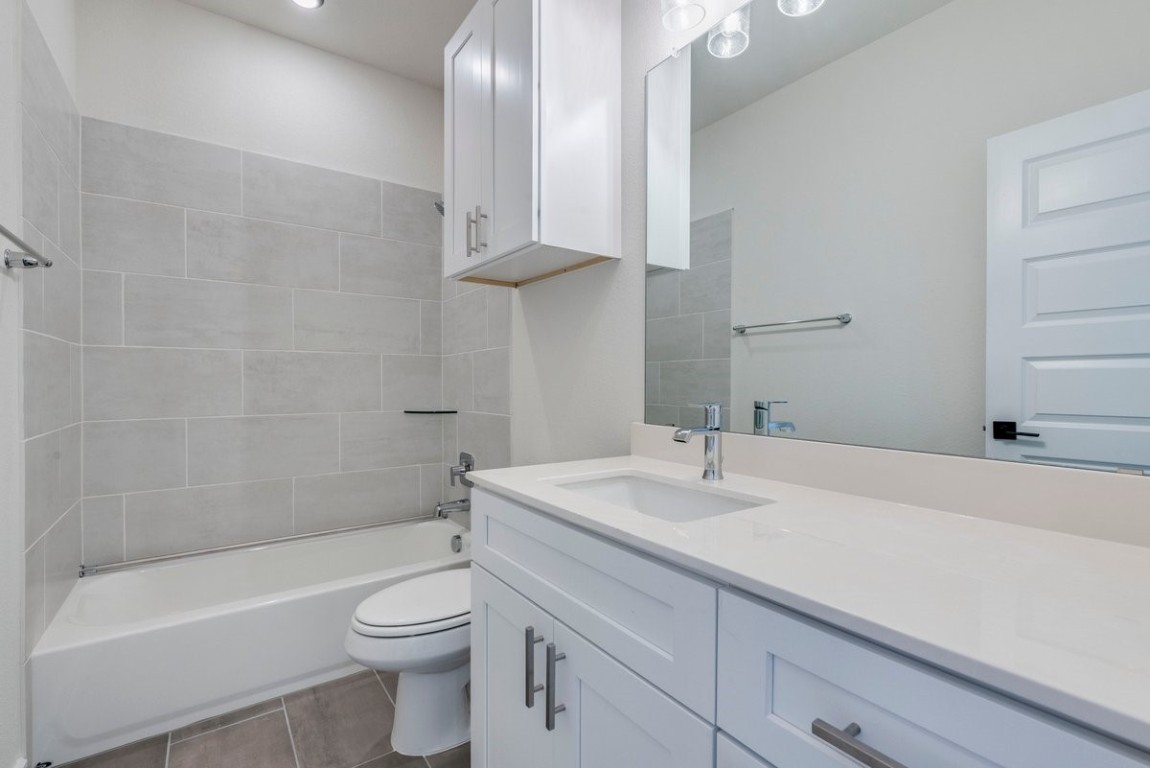 2600 Gattis School Road, Unit 101 Round Rock, TX 78664 - Photo 15 of 23 a bathroom with a sink a toilet and shower