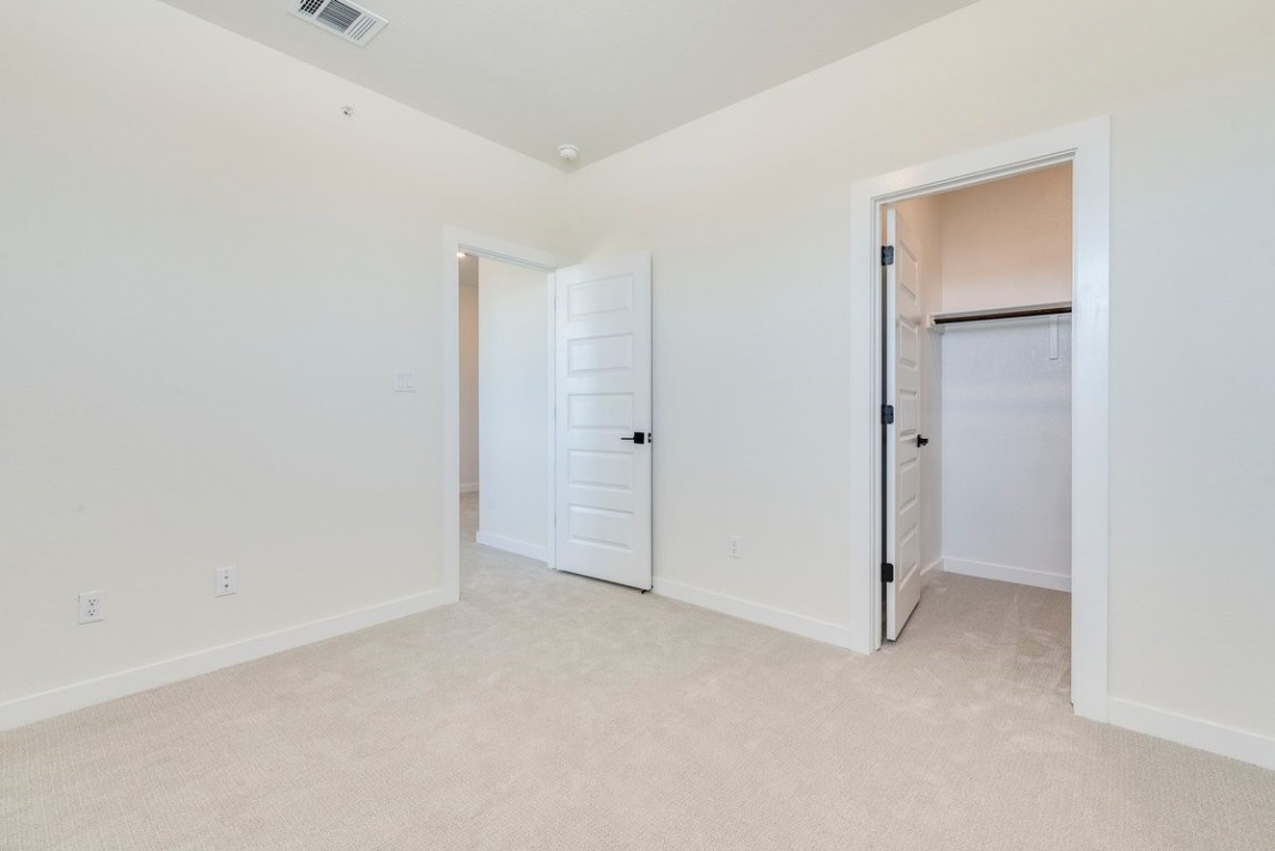 2600 Gattis School Road, Unit 101 Round Rock, TX 78664 - Photo 16 of 23 an empty room with an entryway door