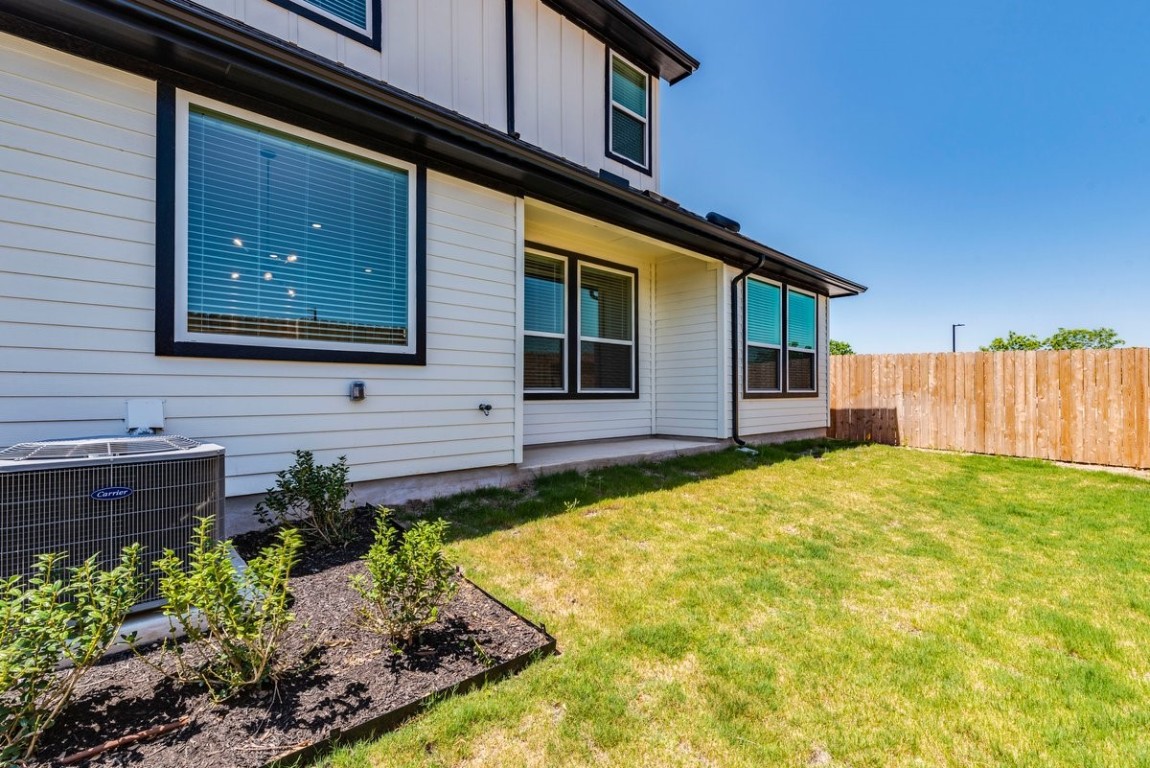 2600 Gattis School Road, Unit 101 Round Rock, TX 78664 - Photo 21 of 23 a front view of a house with a yard