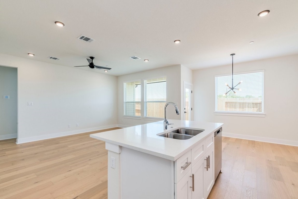 2600 Gattis School Road, Unit 101 Round Rock, TX 78664 - Photo 6 of 23 a kitchen with a sink cabinets and window