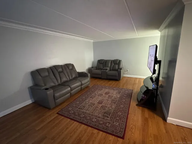 a view of a dining room with furniture and window