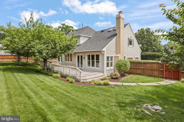 a view of a house with backyard porch and sitting area