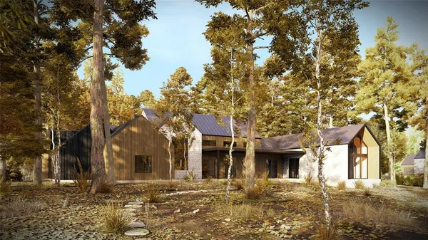 a front view of a building with a garden
